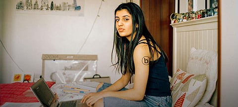 Portrait of a teenage girl on her laptop sporting the 'bodyright' logo. (Photo I UNFPA/Alys Tomlinson)