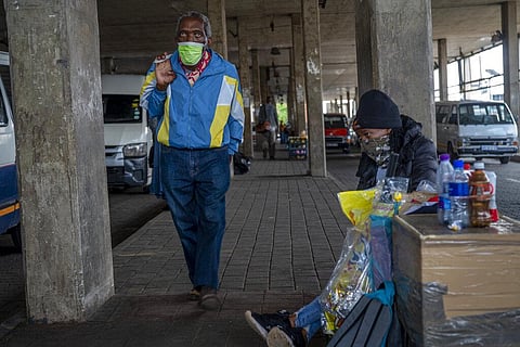 A woman selling snacks, sits at the Baragwanath taxi rank in Soweto, South Africa, Thursday Dec. 2, 2021. (Photo | AP)