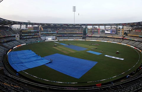 The Wankhede stadium pitch covered owing to rains on Thursday morning.  (Photo | BCCI Twitter)