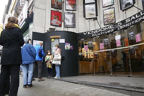 Customers line up outside a cinema in Brussels, Wednesday, Dec. 29, 2021. (Photo | AP)