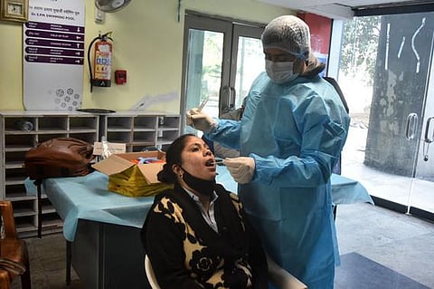 A health worker takes swab sample for COVID-19 test, amid concern over rising Omicron cases, in New Delhi. (File Photo | Shekhar Yadav/EPS)
