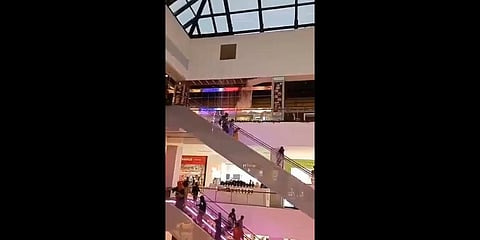 Water pouring down from the broken sealing can be seen just above the escalator (Photo | Video screengrab)