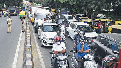Motorists stuck in a traffic jam at Corporation Circle in Bengaluru on Thursday after after pro-Kannada organisations held a massive protest to demand a ban on the Maharashtra Ekikaran Samiti. Traffic