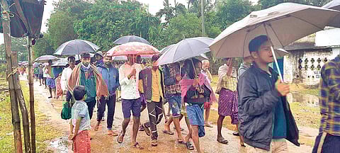 Villagers taking out rally in protest against police action at Govindpur in Dhinkia on Saturday. (Photo | EPS)
