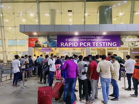 Passengers waiting infront of Rapid PCR centre at Chennai International  Airport. (Photo | Express)