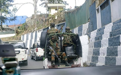 Indian army soldiers ride past the main town in a convoy in Kohima, capital of northeastern Nagaland state, India. (Photo | AP)