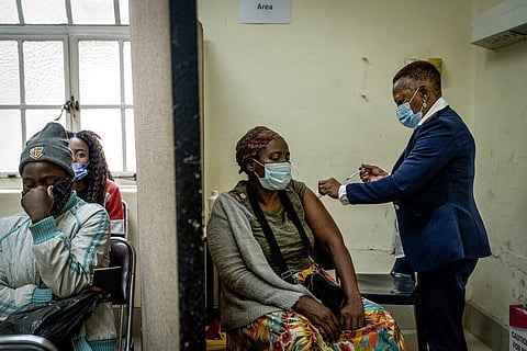 A woman is vaccinated against COVID-19 at the Hillbrow Clinic in Johannesburg, South Africa, Monday Dec. 6, 2021. (Photo | AP)