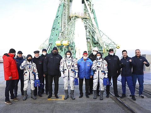 Roscosmos cosmonaut Alexander Misurkin, center, and spaceflight participants Japanese fashion tycoon Yusaku Maezawa, left in space suit, and Japanese producer Yozo Hirano, right. (Photo | AP)