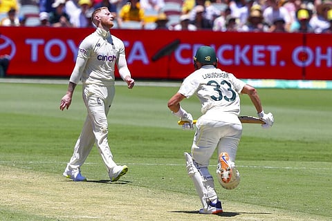 England's Ben Stokes reacts after bowling to Australia's Marnus Labuschagne, right, during day two of the first Ashes cricket test at the Gabba in Brisbane. (Photo | AP)