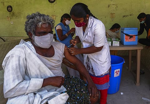A health worker administers COVID-19 vaccine to a man in Hyderabad, India, Wednesday, Dec. 8, 2021. (Photo | AP)