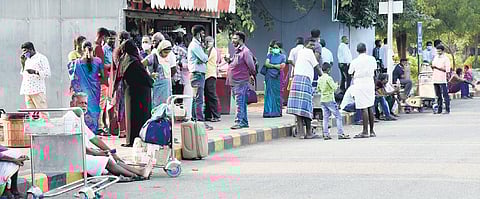 People wait to receive passengers at Tiruchy airport on Wednesday. (Photo | MK Ashok Kumar/EPS)