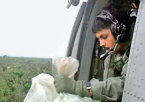 Pradeep Arakkal during the rescue and relief operations in flood-affected areas in a Navy chopper during the 2018 flood. Pradeep boarded the ill-fated helicopter as flight gunner