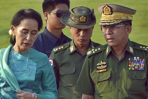 Myanmar's leader Aung San Suu Kyi, left, walks with senior General Min Aung Hlaing, right, Myanmar military's commander-in-chief, in Naypyitaw, Myanmar. (File Photo | AP)