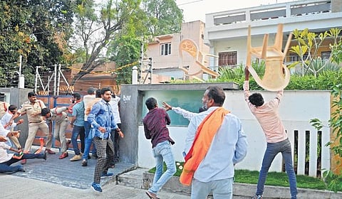 BJP activists, led by the party’s Warangal Urban district president Rao Padma, hurl chairs at TRS MLA Challa Dharma Reddy’s residence in Hanamkonda on Sunday. Cops are also seen trying to control the