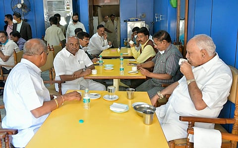 CM BS Yediyurappa (extreme right), Minister Umesh Katti (extreme left) and MLC Adagur H Vishwanath (second from left) having coffee at Janardhan Hotel on Wednesday. (Photo | Special Arrangement)