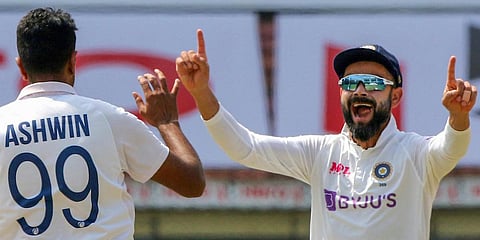 India's Ashwin and Virat Kholi celebrate the dismissal of England's Rory Burns during the 4th day of the first test match at MA Chidambaram Stadium, in Chennai. (Photo | PTI)