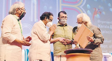 Adoor Gopalakrishnan receiving the lifetime achievement award conferred on Jean-Luc-Godard from Minister A K Balan at the IFFK opening in T’Puram | Vincent Pulickal