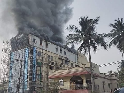 The fire erupted at the top floor of the five-story building following which thick smoke was seen emanating. (Photo | EPS)