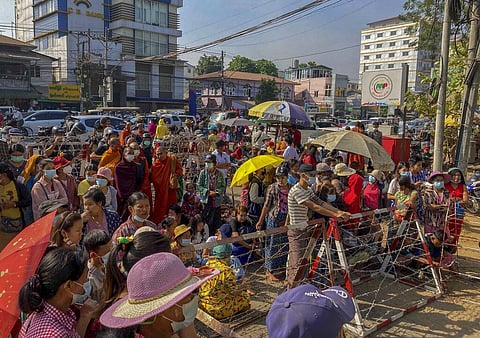 People gather outside Insein prison expecting to see prisoners being released in Yangon (Photo | AP)