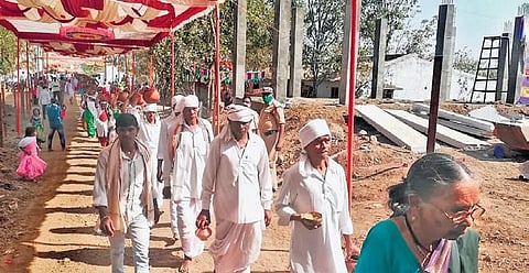 Members of Mesram clan bring holy water to the Keslapur Nagoba temple