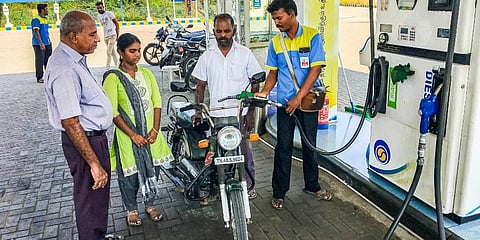 A man getting his vehicle refilled after his daughter recited the Thirukkural couplet (Photo | Express)