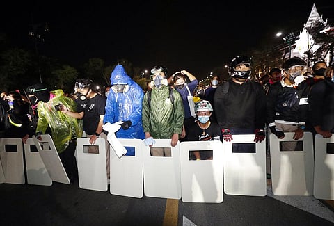 Pro-democracy protesters form a line as they try to march forward during a rally in Bangkok, Thailand. (Photo  |AP)