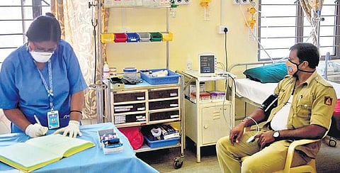 A policeman waits to get vaccinated at the CV Raman Nagar General Hospital in Bengaluru on Saturday  | Meghana Sastry