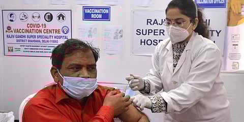 A frontline worker receives a Dose of Covishield Vaccine at Rajiv Gandhi Super Speciality Hospital in New Delhi. (Photo| Parveen Negi, EPS)