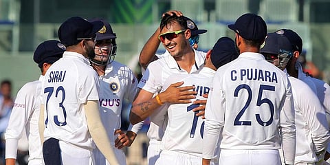India's Axar Patel celebrates with teammates after taking a wicket during the 3rd day of the second test against England, at M.A. Chidambaram Stadium, in Chennai, Monday, Feb. 15, 2021. (Photo | PTI)