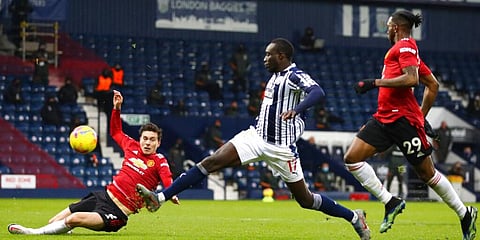 West Bromwich Albion's Mbaye Diagne misses a scoring chance in front Manchester United's Victor Lindelof (L) and Aaron Wan-Bissaka. (Photo | AP)