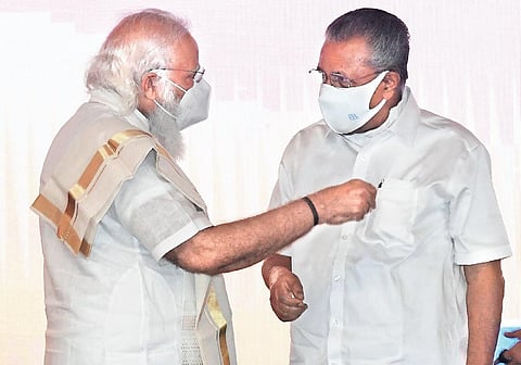 Prime Minister Narendra Modi sharing a light moment with Chief Minister Pinarayi Vijayan during the ceremony to dedicate the Propylene Derivative Petrochemical Project of BPCL to the nation in Kochi.