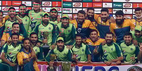 Pakistani players and officials pose for a photograph with the winning trophy of the Twenty20 series against South Africa. (Photo | AP)