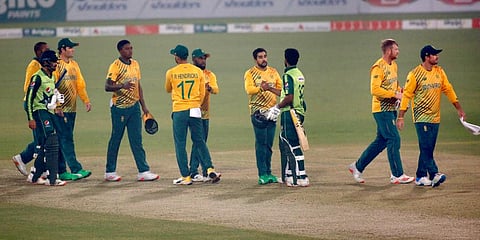 Pakistan's Hasan Ali, third from right, and Mohammad Nawaz, left, shake hands with South Africa players at the end of the third T20 match at the Gaddafi Stadium, in Lahore. (Photo | AP)
