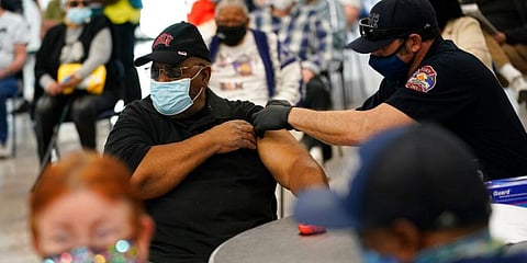 People receive a COVID-19 vaccine at the Martin Luther King Senior Center in North Las Vegas. (Photo | AP)
