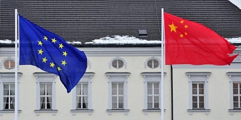 A Chinese (R) and EU flag flutters in front of the presidential palace 'Schloss Bellevue' in Berlin. (File photo| AFP)