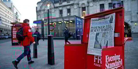 The front page of a newspaper reads that the government is contemplating making it compulsory that all visitors to the UK will have to quarantine in a hotel, after arriving. (File photo| AFP)