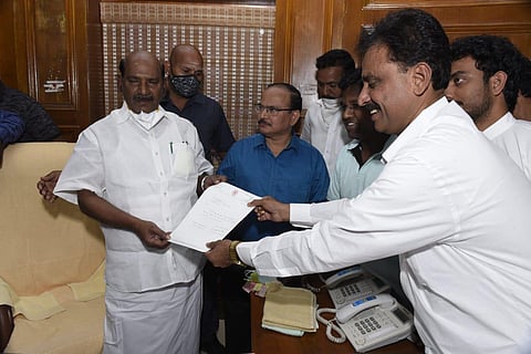 Kamraj Nagar MLA A John Kumar (right) tendering his resignation to Puducherry Speaker VP Sivakolunthu on Tuesday. (Photo | Express)