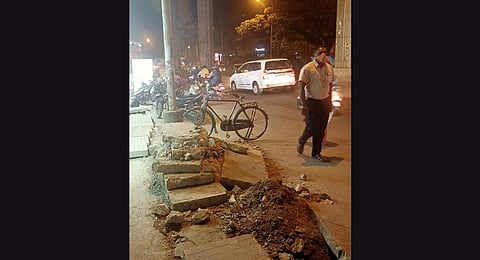 A dug-up footpath outside  Halasuru Metro station.