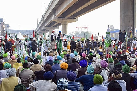 Farmers stage a protest at Tikri border during their ongoing 'Delhi Chalo' agitation against Centre's new farm laws in New Delhi. (File Photo | PTI)