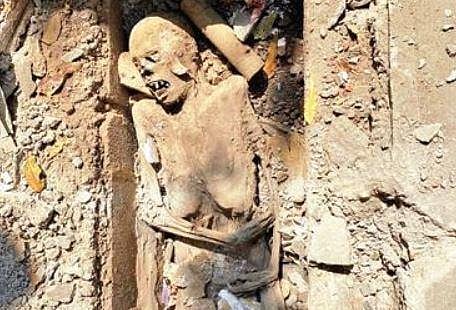 The skeleton, covered in mud, that was found by workers repairing a drain | EXPRESS