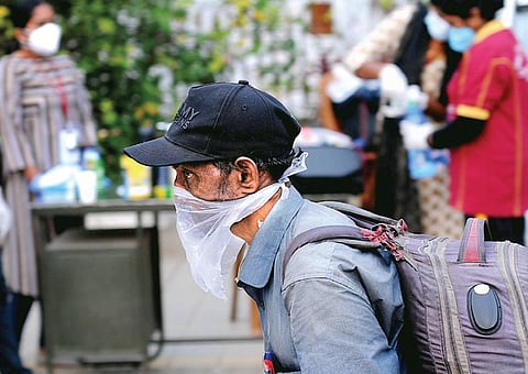A man moving around Kochi wearing a plastic cover as facemask. Despite the rise in Covid cases, many remain callous about safety measures | A Sanesh