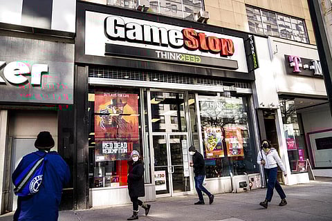 Pedestrians pass a GameStop store on 14th Street at Union Square, New York. (Photo | AP)