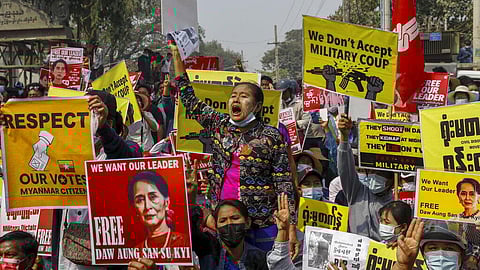 Demonstrators protest against the military junta's arrest and chagrining of National League for Democracy party lawmakers. 
