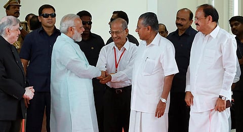 File photo of Prime Minister Narendra Modi congratulating Principal Advisor to DMRC E Sreedharan at the venue of the Kochi Metro launch. (Photo | EPS)
