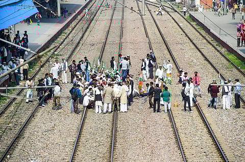 Members of various farmer organisations block a railway track in Sonipat during a four-hour 'rail roko' demonstration across the country. (Photo | PTI)