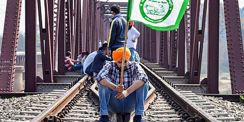 Protesting farmers block railway tracks as part of the nationwide 'Rail Roko Andolan at Shahpur in Ambala. (Photo| PTI)