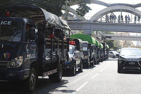 Policemen sit inside trucks parked on a road in the downtown area of Yangon, Myanmar. (Photo | AP)