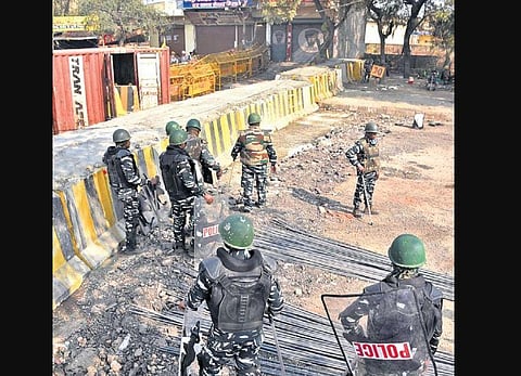 Blockades being set up as part of police security enhancements at Singhu. (Photo | Express)