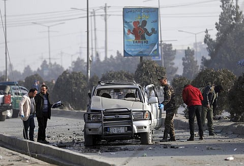 Security personnel inspect the site of a bomb attack in Kabul, Afghanistan, Tuesday, Feb. 2, 2021. (Photo | AP)