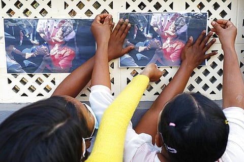 People post photos of Mya Thwet Thwet Khine on the wall during a memorial in Mandalay, Myanmar. (Photo | AP)